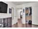 Bright bedroom featuring wood floors, an open closet and view into office space at 235 Desert Arroyo Ct, Henderson, NV 89012
