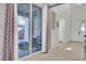 A view from the hallway showing the glass slider to the back yard, and the home's entrance at 235 Desert Arroyo Ct, Henderson, NV 89012