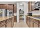 Spacious kitchen featuring granite countertops, stainless appliances, and walk-in pantry at 235 Desert Arroyo Ct, Henderson, NV 89012