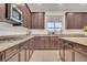Gourmet kitchen featuring granite countertops, stainless steel appliances, and abundant cabinet space at 235 Desert Arroyo Ct, Henderson, NV 89012