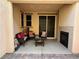 Cozy covered patio with fireplace and outdoor seating at 235 Desert Arroyo Ct, Henderson, NV 89012