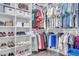 Spacious walk-in closet with custom shelving, rods, and ample storage for clothes, bags, and shoes at 235 Desert Arroyo Ct, Henderson, NV 89012