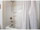 Bathroom shower-tub combo with white tile surround at 2422 Fasano St, Henderson, NV 89044