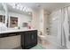 Bathroom features a double sink vanity and a shower-tub combo with tile surround at 2422 Fasano St, Henderson, NV 89044