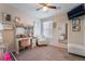 Bedroom features an organized desk, stylish chair, and full-length mirror, all contributing to a bright atmosphere at 2422 Fasano St, Henderson, NV 89044