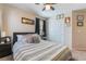 Bedroom featuring a comfortable bed with decorative pillows and a sliding door closet at 2422 Fasano St, Henderson, NV 89044