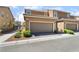 Exterior of a two-story home with a two-car garage and low-maintenance landscaping at 2422 Fasano St, Henderson, NV 89044