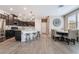 Open floor plan featuring a modern kitchen with a dining area and a large center island at 2422 Fasano St, Henderson, NV 89044