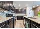Well-equipped kitchen with granite countertops, stainless steel appliances, and tile backsplash at 2422 Fasano St, Henderson, NV 89044