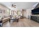 Comfortable living room with modern furnishings, lots of light, and an entertainment center at 2422 Fasano St, Henderson, NV 89044