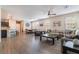 Spacious open-concept living room and dining area with wood-look floors and plenty of natural light at 2422 Fasano St, Henderson, NV 89044
