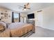 Large bedroom with a ceiling fan, carpet flooring, and decor throughout at 2422 Fasano St, Henderson, NV 89044