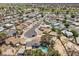 Aerial view showcasing the property's location within a suburban neighborhood near a golf course at 2447 Tournament St, Las Vegas, NV 89142