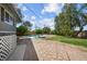 Enjoy the serene backyard with lush lawn, stone patio, and swimming pool at 2447 Tournament St, Las Vegas, NV 89142