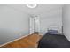 Modest bedroom with hardwood floors and easy access to another room at 2447 Tournament St, Las Vegas, NV 89142