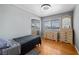 Modest bedroom with hardwood floors, closet and neutral decor at 2447 Tournament St, Las Vegas, NV 89142