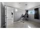 Clean bedroom with tiled floors, gray walls and access to other rooms at 2447 Tournament St, Las Vegas, NV 89142