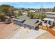 Well-kept home featuring an expansive driveway and a separate storage shed in the backyard at 2447 Tournament St, Las Vegas, NV 89142