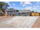 Charming two-story home featuring a manicured lawn, driveway, and serene curb appeal at 2447 Tournament St, Las Vegas, NV 89142