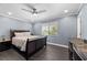 Comfortable main bedroom with a ceiling fan and natural lighting at 2447 Tournament St, Las Vegas, NV 89142