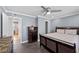 Comfortable main bedroom with a ceiling fan and modern decor at 2447 Tournament St, Las Vegas, NV 89142