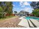 Enjoy this backyard oasis with a sparkling pool and ample patio space for outdoor entertaining at 2447 Tournament St, Las Vegas, NV 89142