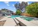 Relax in this backyard with a beautiful pool, spa, and well-maintained landscaping at 2447 Tournament St, Las Vegas, NV 89142