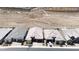 A high-angle view of similar homes in a planned community bordering desert landscape at 2719 Canvas Sky St, Henderson, NV 89044