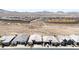 A distant aerial shot of a housing tract bordering sports complex and desert at 2719 Canvas Sky St, Henderson, NV 89044
