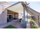 Backyard with a putting green, outdoor kitchen, and a shaded patio area at 2719 Canvas Sky St, Henderson, NV 89044