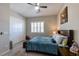 Bedroom featuring carpet, ceiling fan, sliding door closet and window with shutters at 2719 Canvas Sky St, Henderson, NV 89044