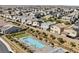 Aerial view of community pool with lounge seating and neighborhood homes in the background at 2719 Canvas Sky St, Henderson, NV 89044