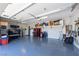View of the ample garage space with epoxy floor and custom storage solutions at 2719 Canvas Sky St, Henderson, NV 89044