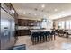 Open-concept kitchen featuring a center island, stainless steel appliances, and pendant lighting at 2719 Canvas Sky St, Henderson, NV 89044