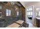 Walk-in shower with a glass enclosure in the main bathroom, providing a spa-like experience at 2719 Canvas Sky St, Henderson, NV 89044