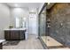 Main bathroom with a walk-in shower, a double sink vanity, and tile flooring at 2719 Canvas Sky St, Henderson, NV 89044