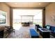 Covered outdoor patio with built in grill, fire pit, and ample seating at 2719 Canvas Sky St, Henderson, NV 89044