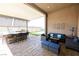 Outdoor entertaining space with a full outdoor kitchen and covered seating area at 2719 Canvas Sky St, Henderson, NV 89044
