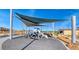 Playground with modern climbing structure and shade covers in a community park at 2719 Canvas Sky St, Henderson, NV 89044