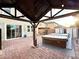Charming backyard features brick pavers, a hot tub, and a covered patio, creating a perfect outdoor retreat at 2922 Tranquil Brook Ave, Henderson, NV 89044