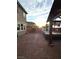 Spacious backyard featuring a hot tub, brick pavers, and a cozy pergola for outdoor relaxation at 2922 Tranquil Brook Ave, Henderson, NV 89044