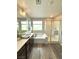 Elegant bathroom featuring a double sink vanity, soaking tub, and glass-enclosed shower, blending style and functionality at 2922 Tranquil Brook Ave, Henderson, NV 89044