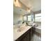 Bright bathroom with double sinks, tub, and a separate shower, offering a relaxing and functional space at 2922 Tranquil Brook Ave, Henderson, NV 89044