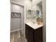 Well-lit bathroom with a modern vanity, decorative mirror, and stylish accents at 2922 Tranquil Brook Ave, Henderson, NV 89044
