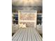 Comfortable bedroom with Murphy bed, built-in shelving, and decorative brick-patterned headboard at 2922 Tranquil Brook Ave, Henderson, NV 89044