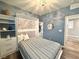 Bedroom features stylish Murphy bed with built-in storage and soft blue accent wall at 2922 Tranquil Brook Ave, Henderson, NV 89044