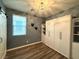 Bedroom featuring a stylish Murphy bed with built-in storage and a modern light fixture at 2922 Tranquil Brook Ave, Henderson, NV 89044