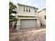 Inviting two-story home showcasing a two-car garage and meticulously paved driveway at 2922 Tranquil Brook Ave, Henderson, NV 89044