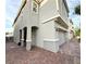 A side view of the charming home showcasing the two-car garage and brick paved driveway at 2922 Tranquil Brook Ave, Henderson, NV 89044