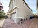 Angle view showing the side of the house with a two car garage and brick paved driveway at 2922 Tranquil Brook Ave, Henderson, NV 89044